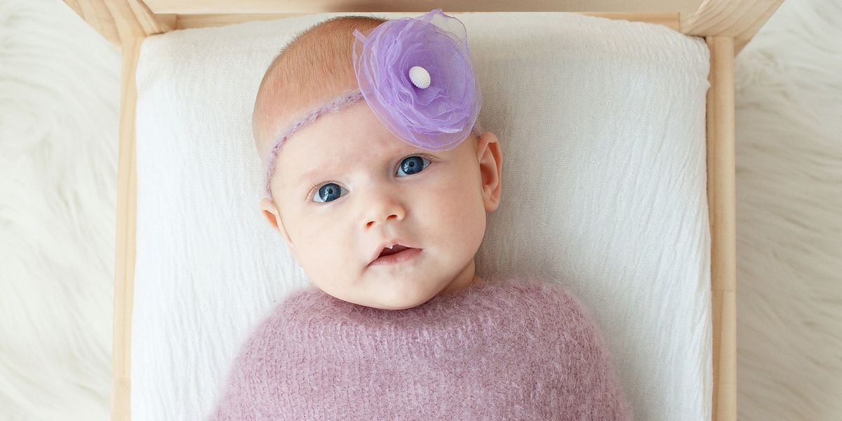 Baby with purple flower headband