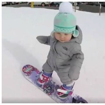 baby snowboarder