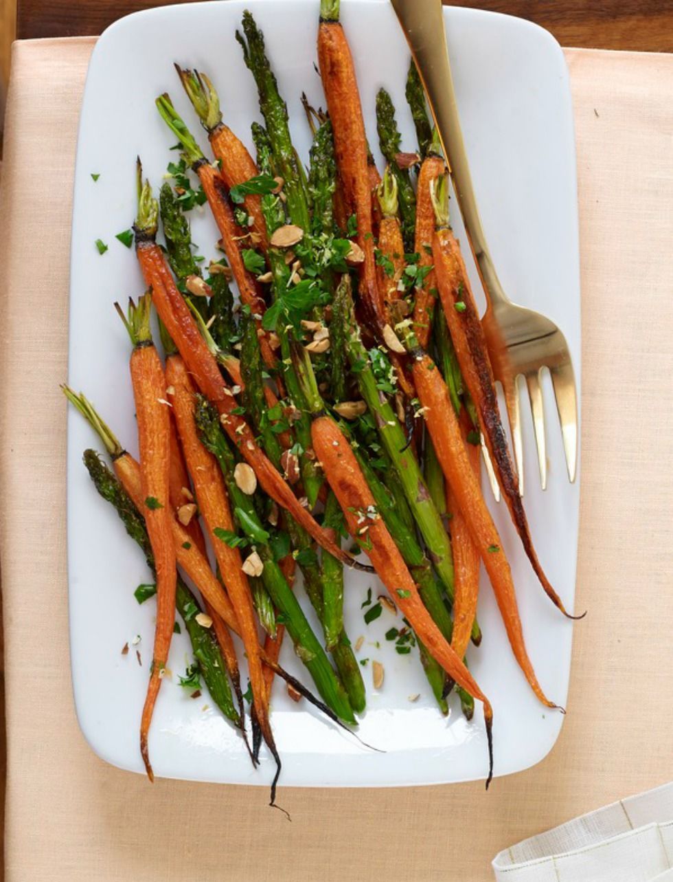 Recipe for roasted carrots and asparagus with almond gremolata.