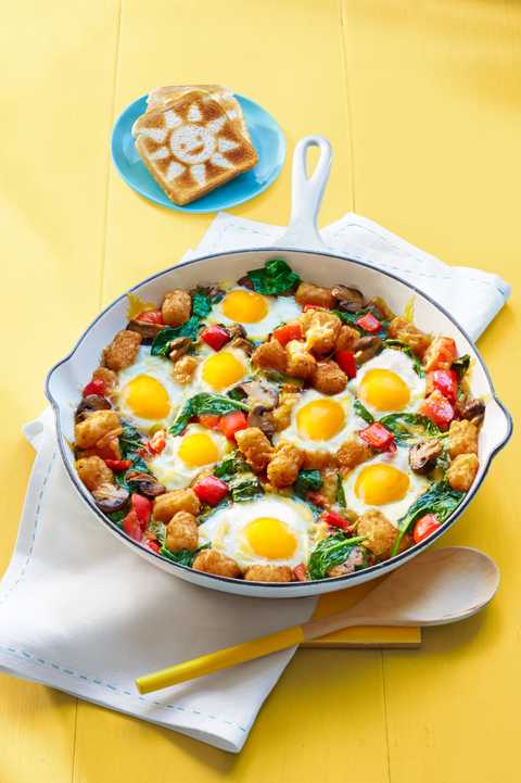 breakfast ideas for kids egg and tater bake in skillet on yellow table