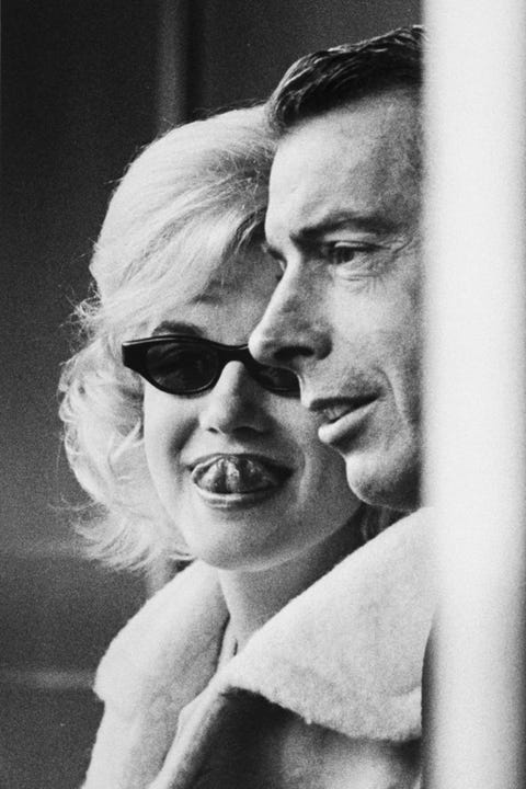 image Candid of actress Marilyn Monroe (L) & ex-husband Joe DiMaggio (R) attending opening game at Yankee Stadium. (Photo by Lee Lockwood/The LIFE Images Collection/Getty Images)