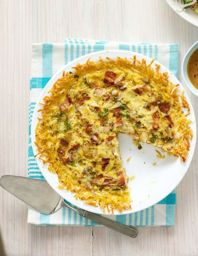 quiche lorraine with hash brown crust on white plate