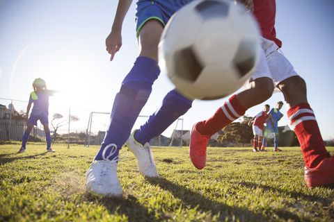 Leg, Grass, Human leg, Football, Ball, Soccer ball, Ball game, Playing sports, Soccer, Football equipment, 