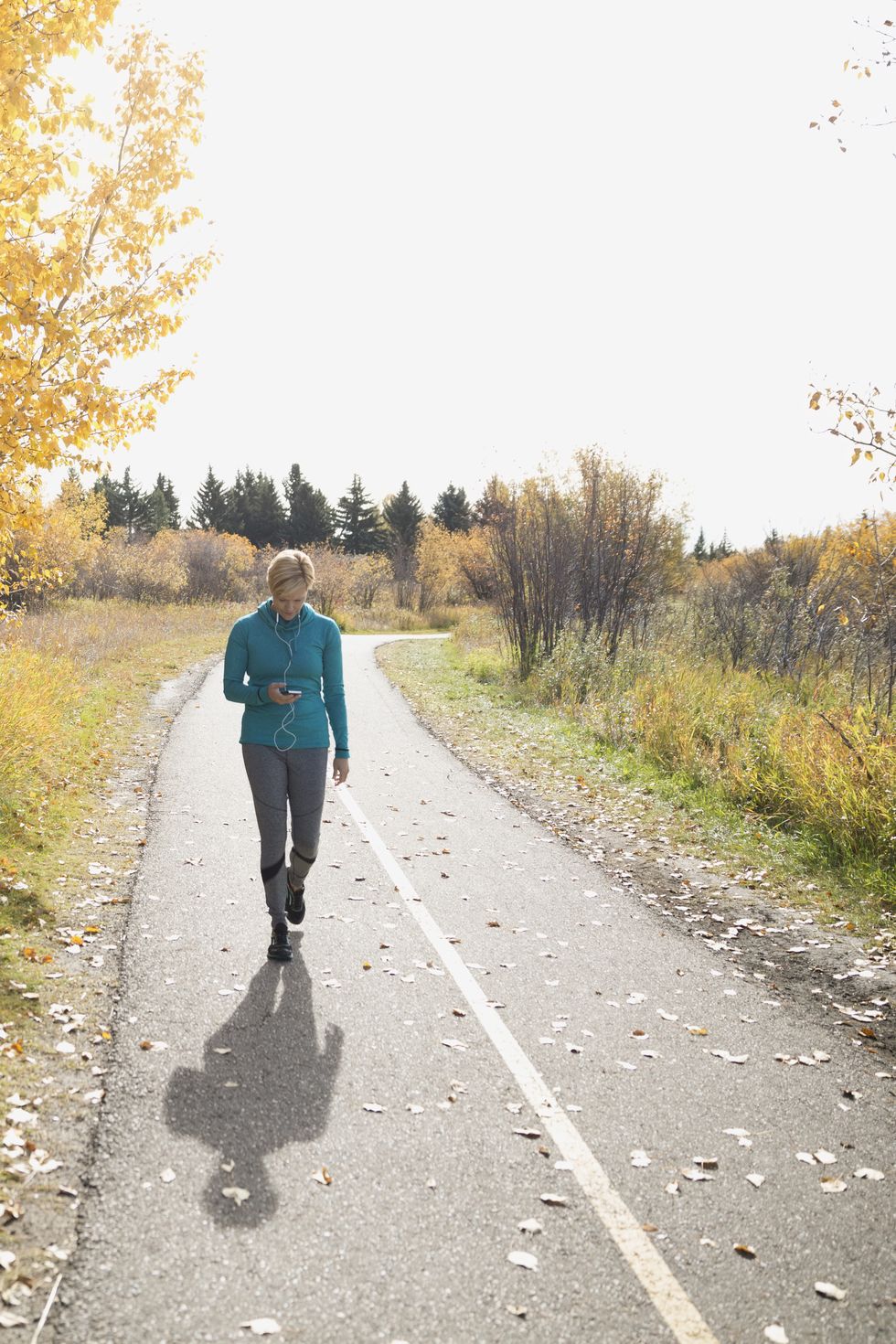 Road, Road surface, Asphalt, People in nature, Thoroughfare, Trail, Walking, Street fashion, Pedestrian, Sidewalk, 