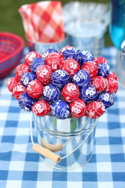 16 Best 4th Of July Decorations Patriotic Decorating Ideas For Courtesy Of Gluesticks Patriotic Lollipop Centerpiece Serving Double Duty This 4th July Table