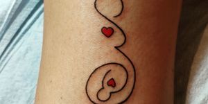 Skin, Joint, Tan, Tattoo, Symbol, Temporary tattoo, Flesh, 
