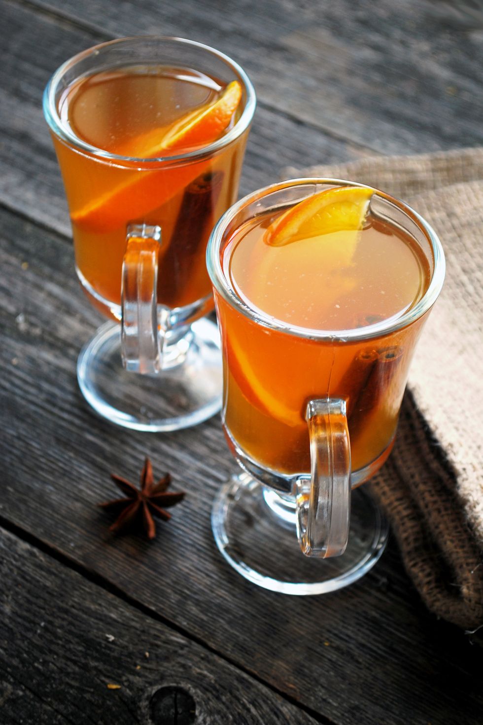 fall date ideas two cups of mulled cider on a wooden table