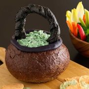 halloween appetizers spinach dip in a bread bowl cauldron