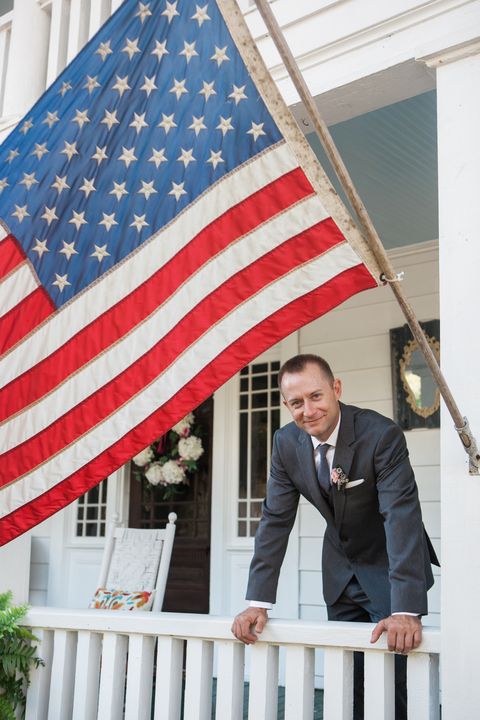 Flag, Coat, Dress shirt, Flag of the united states, Property, Outerwear, Collar, Suit, Formal wear, Real estate, 