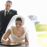 Photograph, Bride, Wedding dress, Marriage, Formal wear, Ceremony, Sitting, Dress, Wedding, Bridal clothing, 