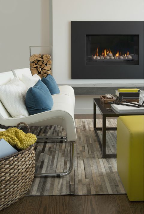 Living room, Furniture, Floor, Room, Hearth, Wood flooring, Fireplace, Laminate flooring, Yellow, Interior design, 