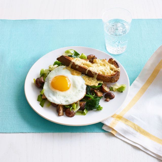 leeks and mushrooms on cheesy toasts with fried eggs