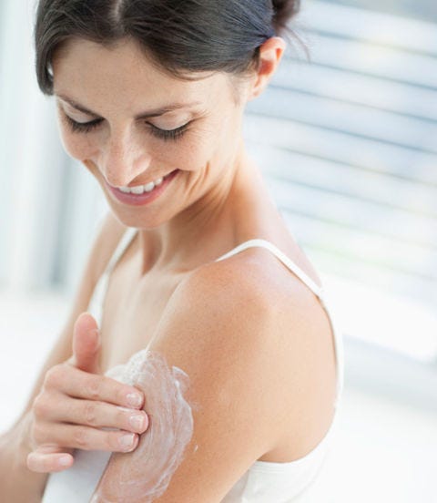 Learn the Lingo woman rubbing lotion on her arm
