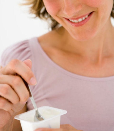 Yogurt woman eating yogurt