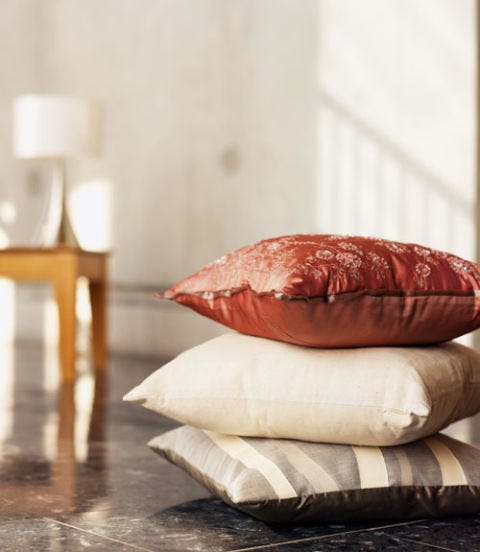 Build an Obstacle Course pillows stacked on the floor