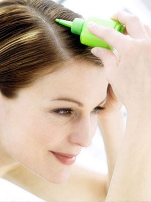 woman dying her hair at home