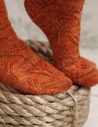 Brown, Skin, Human leg, Joint, Pattern, Orange, Sock, Tan, Close-up, Foot, 