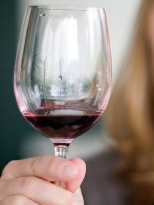 Rate-Your-Risk Guide woman enjoying a glass of wine
