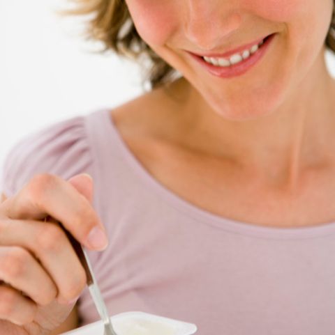 woman eating yogurt