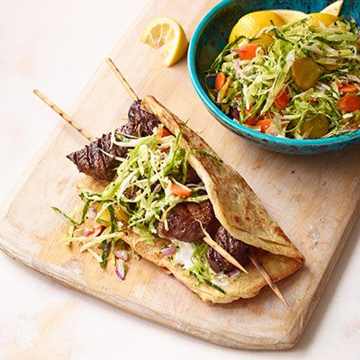 kebabs with cabbage carrot and pickle slaw