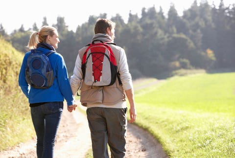 “If I get sick, he won't be able to hold it together.” couple walking with backpacks on