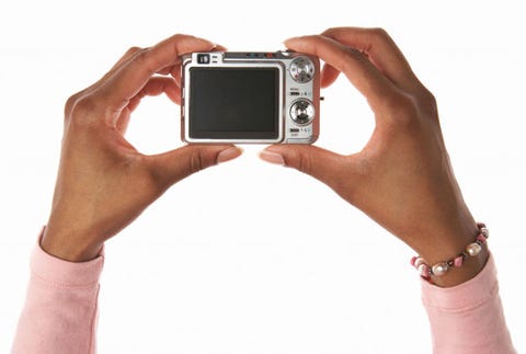Digital Cameras woman holding a digital camera