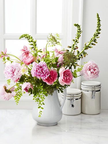 6 Pro Arranging Tips <p>1. Start with Variety</p> <p>For a more interesting and colorful bouquet, select some flowers that have already bloomed and others that are just budding.</p> <p>2. Prep Smart</p> <p>Clear a table or counter and group your flowers in loose piles so you can quickly pick up separate stems. Fill a vase two-thirds full with cool water.</p> <p>3. Cut Right</p> <p>Using sharp scissors, trim stems as you go to avoid wilting (cut at a 45-degree angle so they get more water). To prevent mold, strip leaves that will sit in the water.</p> <p>4. Go in Order</p> <p>Add greenery to the vase first to create a base for your arrangement; allow some to drape over the sides. Layer in larger blossoms before filling in with smaller buds.</p> <p>5. Forget Perfect Symmetry</p> <p>Aim for off-center harmony instead: Pair two of your bigger flowers on one side of the vase and add a single blossom on the opposite side. Repeat as needed.</p> <p>6. Zoom Out</p> <p>Step back and look at your bouquet. Do you like the shape? The color? Balance any overly green patches with sparser flowers or fill in holes with greenery.</p>