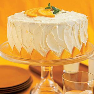 Buttercream cake with candied orange slices and decorated with sugared  fruit. | Orange wedding cake, Citrus cake, Cake